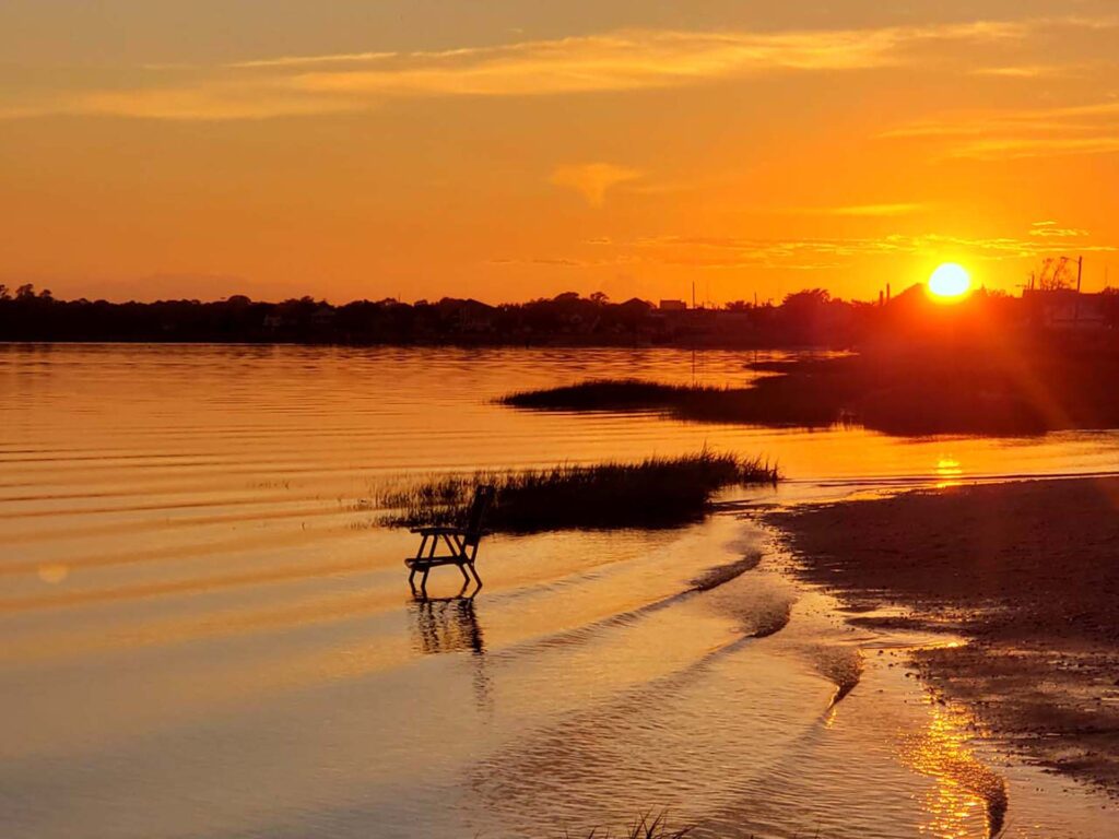 Sunset over Pleasantville NJ bay with vibrant orange skies