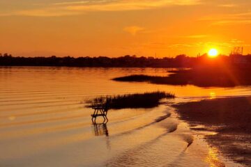 Sunset over Pleasantville NJ bay with vibrant orange skies